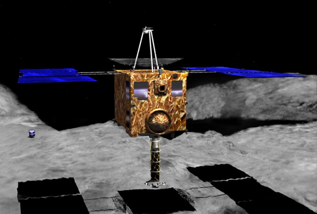 Sonda Hayabusa-2 těsně před odběrem povrchových vzorků z planetky Ryugu. Vlevo vzadu je jedno z průzkumných vozítek (kresba ©JAXA)